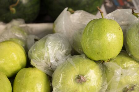 Guava for sale at market stallの写真素材