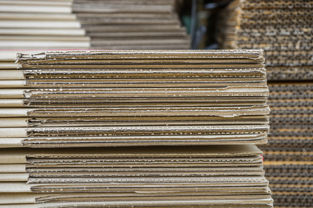 stack of corrugated cardboard boxes. egde view of flattened boxes.の写真素材