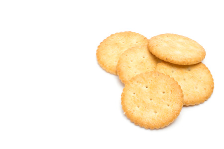 Crackers stacked isolated over white backgroundの写真素材
