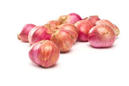 shallots isolated on white background with not beautiful peel, shallots with real peel skinの写真素材