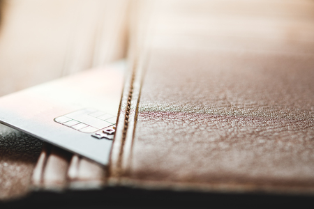 Credit cards in brown wallet with shallow focus