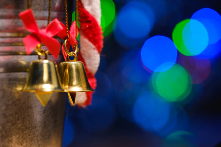 christmas bells decorations with background of bokeh blurred lighting, low key pictureの写真素材