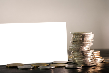 Coins money with blank name card or business cardの写真素材