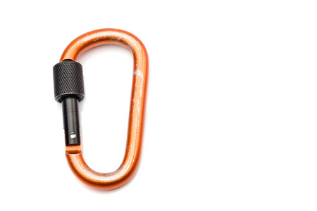 Carabiner D-Shaped in orange color with black locking isolated on white backgroundの写真素材