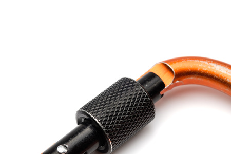 Close up black locking of orange Carabiner on white background