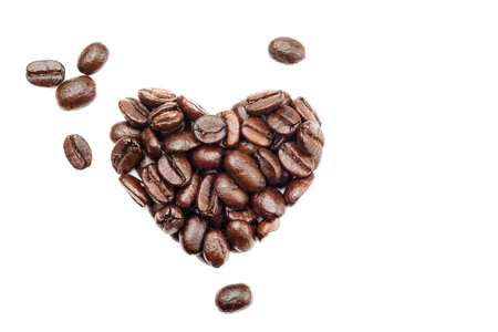 Coffee beans in heart shape isolated on white backgroundの写真素材