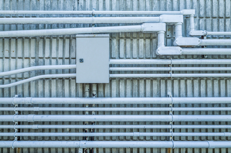 electrical conduit on concrete wall in cold tone pictureの写真素材
