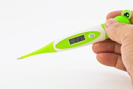 electronic thermometer in hand on a white