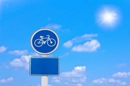 roadside bicycle sign on a cloudy backgroundの写真素材