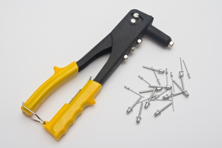 riveters and rivets on white backgroundの写真素材