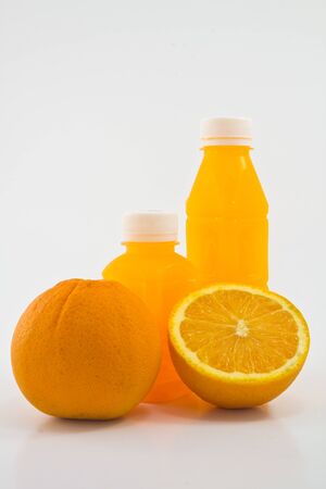  Orange fruit and a bottle with fresh orange juiceの写真素材
