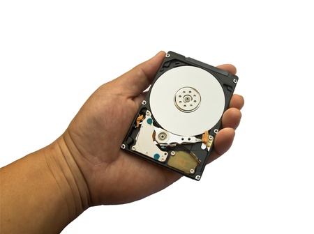  Hard disk drive held in a handの写真素材