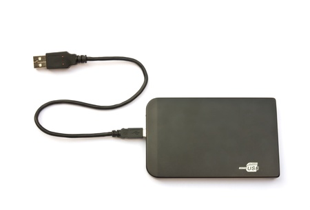 Portable external hard disk drive with USB cable on white backgroundの写真素材