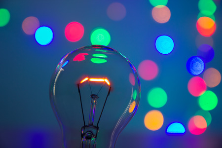 light bulb in bokeh backgroundの写真素材