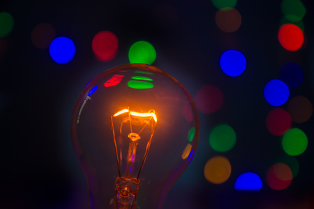 light bulb in bokeh backgroundの写真素材