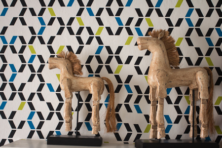 Old wooden horse decoration on the wallの写真素材