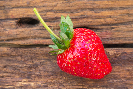 Close up of strawberry on wooden backgroundの写真素材