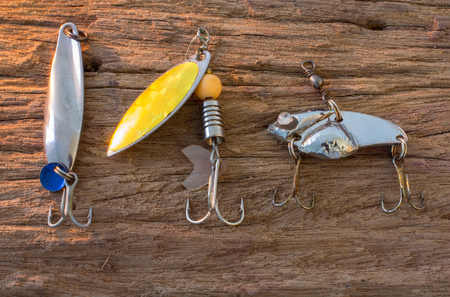 Fishing hook on wood backgroundの写真素材