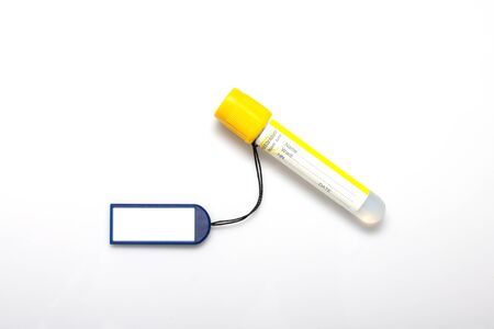 Blank tag label and test tube on white backgroundの写真素材