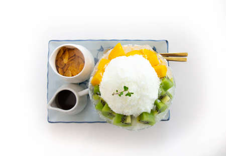 Sweet ice dessert, Bingsu mixed fruits, Kiwi and mango.の写真素材