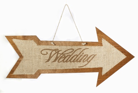 Burlap wedding sign arrow on the woodの写真素材
