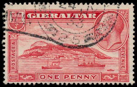 GIBRALTAR - CIRCA 1931: A stamp printed in GIBRALTAR shows image of the George V was King of the United Kingdom and the Dominions of the British Commonwealth, circa 1931.のeditorial素材