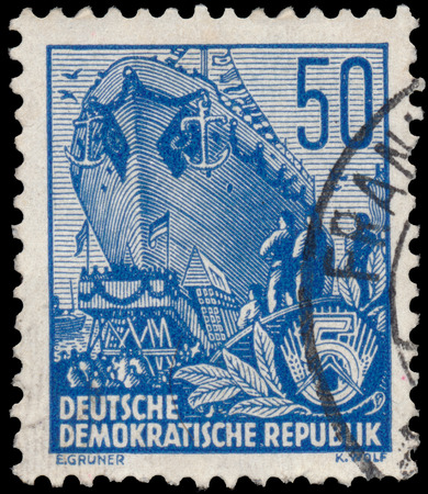 DDR - CIRCA 1955: A stamp printed in DDR, shows an Ocean-going ship on stack, series Five-year plan, circa 1955のeditorial素材