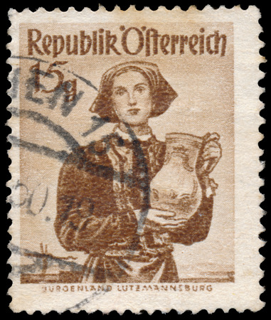 AUSTRIA - CIRCA 1949: A stamp printed in Austria, shows a woman in national dress, circa 1949のeditorial素材