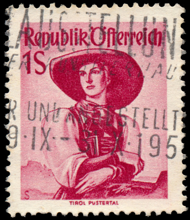 AUSTRIA - CIRCA 1949: A stamp printed in Austria, shows a woman in national dress, Tirol, Pustertal, circa 1949のeditorial素材