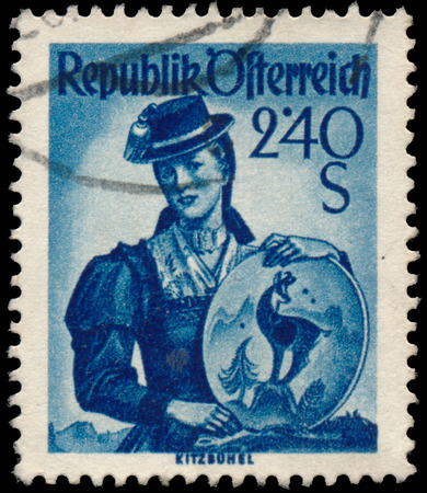 AUSTRIA - CIRCA 1949: A stamp printed in Austria, shows a woman in national dress, Kitzb?hel, circa 1949のeditorial素材