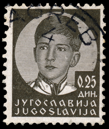 YUGOSLAVIA - CIRCA 1935: A stamp printed in Yugoslavia shows King Peter II, circa 1935.のeditorial素材