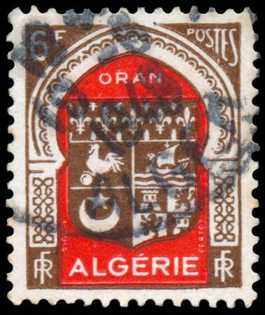 ALGERIA - CIRCA 1947: A stamp printed in Algeria from the "Various Arms" issue shows Algiers arms, circa 1947のeditorial素材