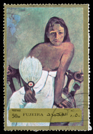 FUJEIRA - CIRCA 1972: Stamp printed in Fujeira shows Paul Gauguin Tahitiennes girl, series Nude Paintings, circa 1972.のeditorial素材
