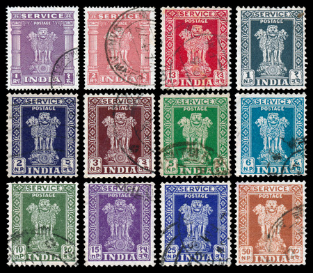 INDIA - CIRCA 1950: Set of stamps printed in India shows four Indian lions capital of Ashoka Pillar, circa 1950.のeditorial素材
