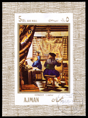 UAE AJMAN - CIRCA 1968: a stamp printed in Ajman UAE Shows the picture 'The Art of Painting', painted by the famous artist Johannes Vermeer Dutch baroqueのeditorial素材