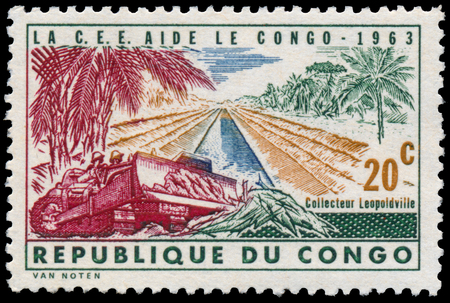 CONGO - CIRCA 1963: a stamp printed in Congo shows construction of roadのeditorial素材