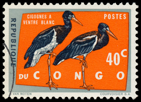 REPUBLIC OF CONGO Democratic - CIRCA 1963: a stamp printed in Congo Shows black storkのeditorial素材