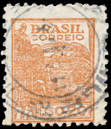 BUDAPEST, HUNGARY - 20 february 2016: a stamp printed in the Brazil showsWheat harvesting machinery, circa 1946のeditorial素材