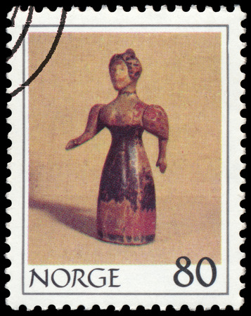 BUDAPEST, HUNGARY - 21 february 2016: a stamp printed in the Norway shows Wooden woman, circa 1978のeditorial素材