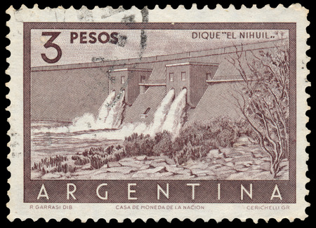 BUDAPEST, HUNGARY - 13 october 2015: a stamp printed by Argentina shows Nihuil Dam, Mendoza, circa 1956のeditorial素材