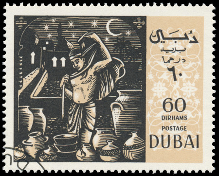 BUDAPEST, HUNGARY - 01 march 2016:  a stamp printed in the Dubai shows shows scene by Omar Khayyam - Arab Philosopher and Poet, circa 1967のeditorial素材