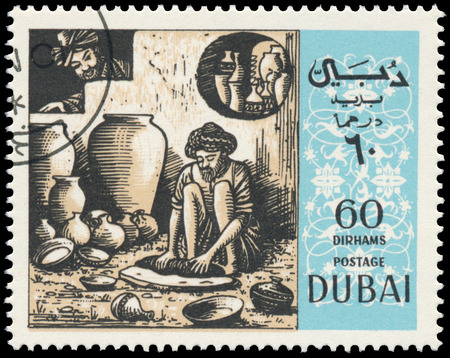 BUDAPEST, HUNGARY - 01 march 2016:  a stamp printed in the Dubai shows shows scene by Omar Khayyam - Arab Philosopher and Poet, circa 1967のeditorial素材
