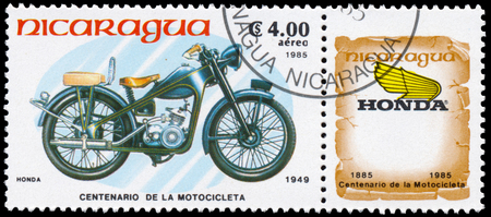 BUDAPEST, HUNGARY - 18 march 2016:  a stamp printed in Nicaragua shows image of a vintage motorcycle, Honda 1949, circa 1985のeditorial素材