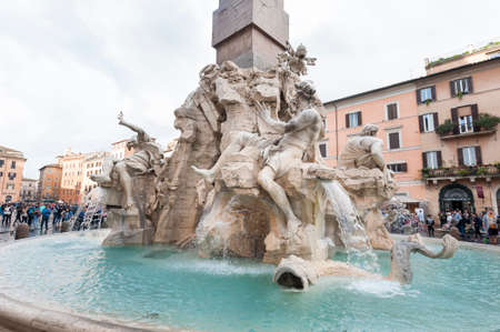 Rome, Italy - october 06 2018: Fountain of the Four Rivers with an Egyptian obelisk and Sant Agnese Church on the famous Piazza Navona Square in Rome, Italy.のeditorial素材