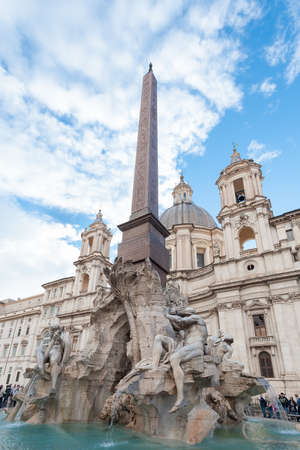 Rome, Italy - october 06 2018: Fountain of the Four Rivers with an Egyptian obelisk and Sant Agnese Church on the famous Piazza Navona Square in Rome, Italy.のeditorial素材