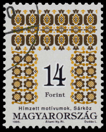 BUDAPEST, HUNGARY - 02 februar 2015:  A stamp printed in Hungary shows Folk motives of Sarkoz, Hungarian Folk Art serie - circa 1995のeditorial素材