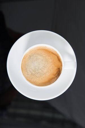 Coffee Cup filled with coffee top viewの写真素材