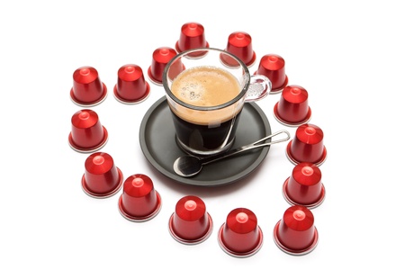 A cup of espresso coffee capsules on a white background in the form of heartのeditorial素材