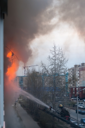 Extinguish a fire in the apartment from the streetのeditorial素材