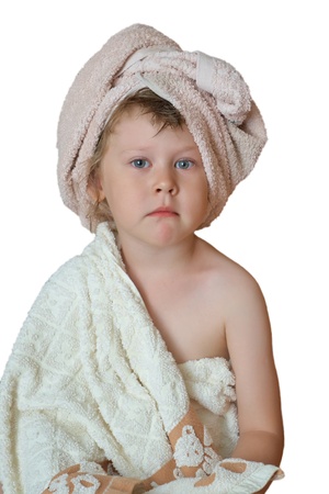 Child after a bath on a white backgroundの写真素材